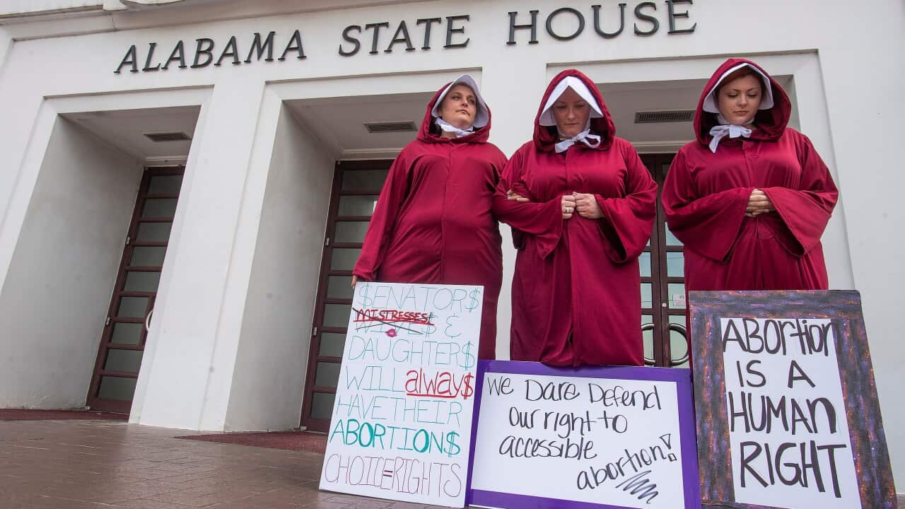 Dressed as handmaids, women protested the abortion ban bill at the Alabama State House in Montgomery last month.