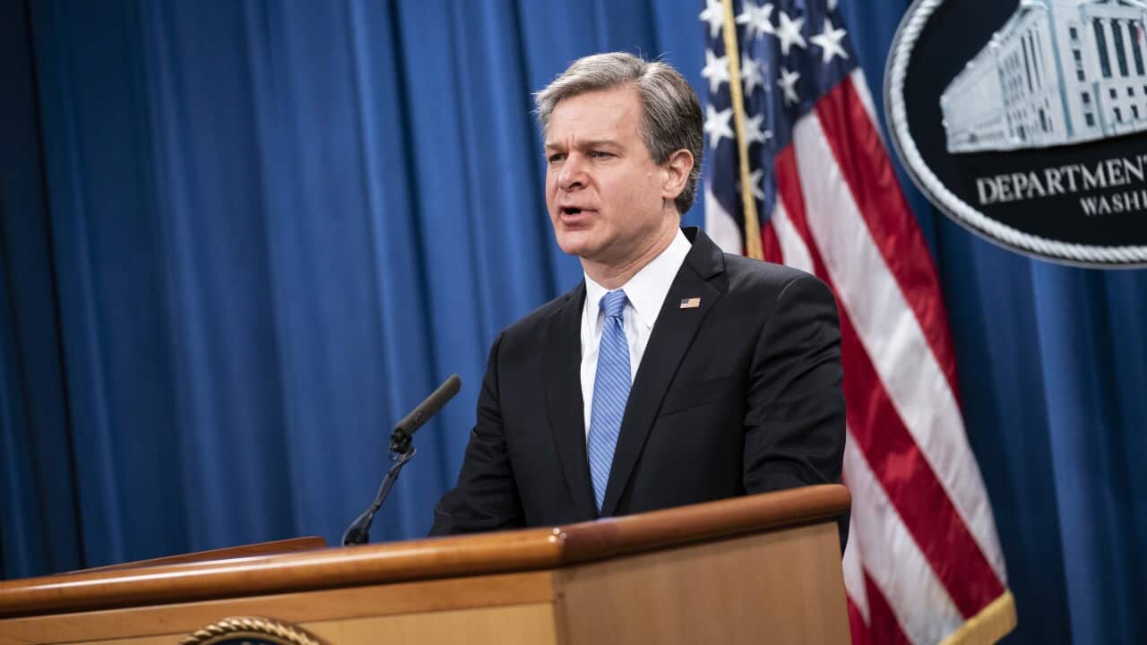 FBI Director Christopher Wray speaks during a virtual news conference at the Department of Justice in Washington on 28 October.