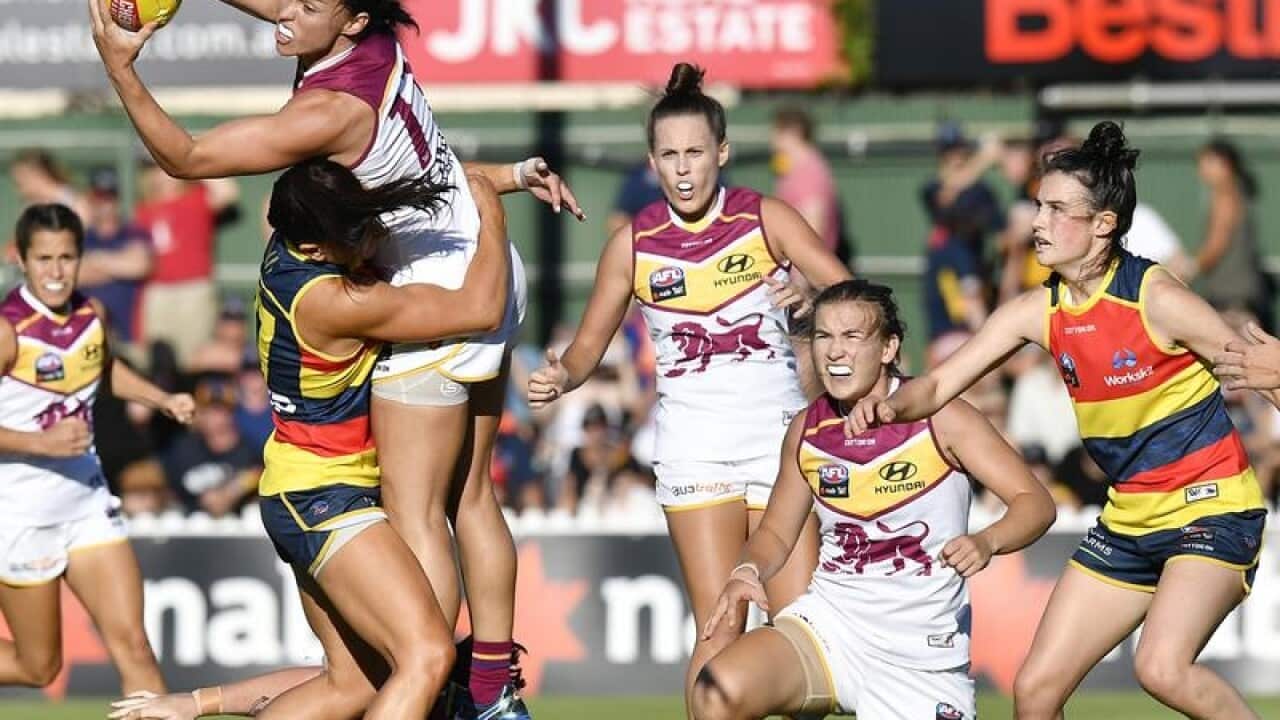 Leah Kaslartakes of Brisbane takes a mark