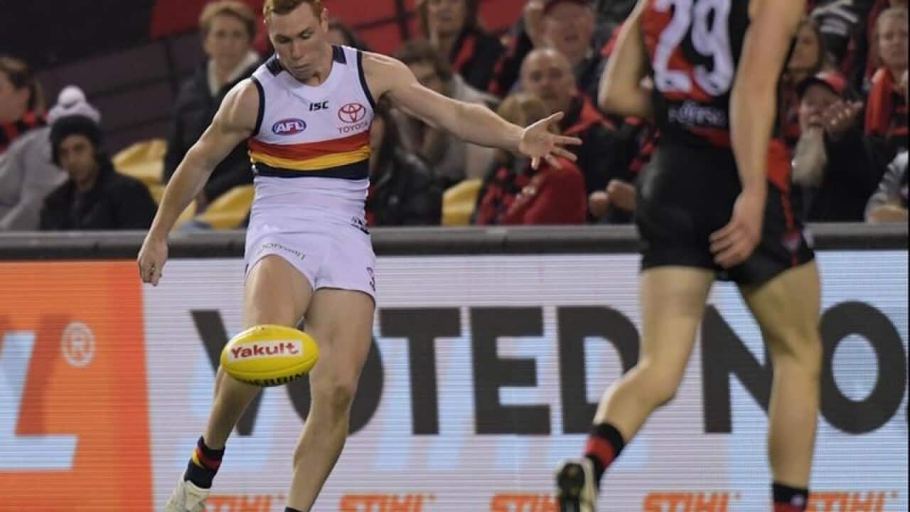 Tom Lynch of the Crows scores a goal.