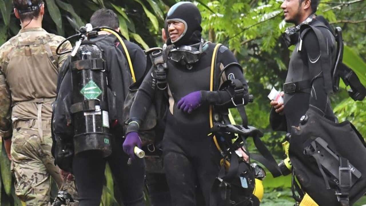 Some of the divers outside the cave