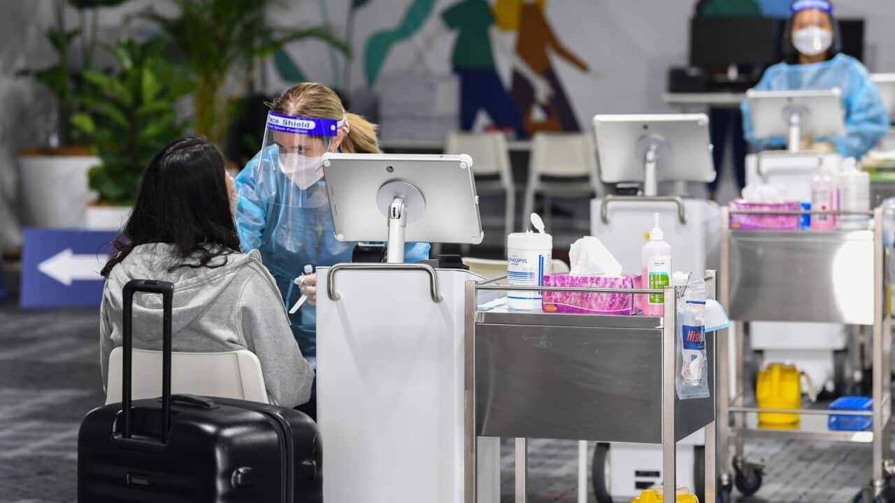 Passengers undergo COVID-19 tests at the Histopath Diagnostic Specialists pre-departure area at Sydney International Airport on November 28, 2021 in Sydney, Australia