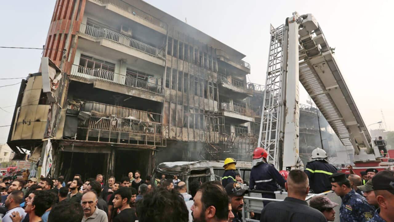 The site of suicide car bomb attack in the Karada district