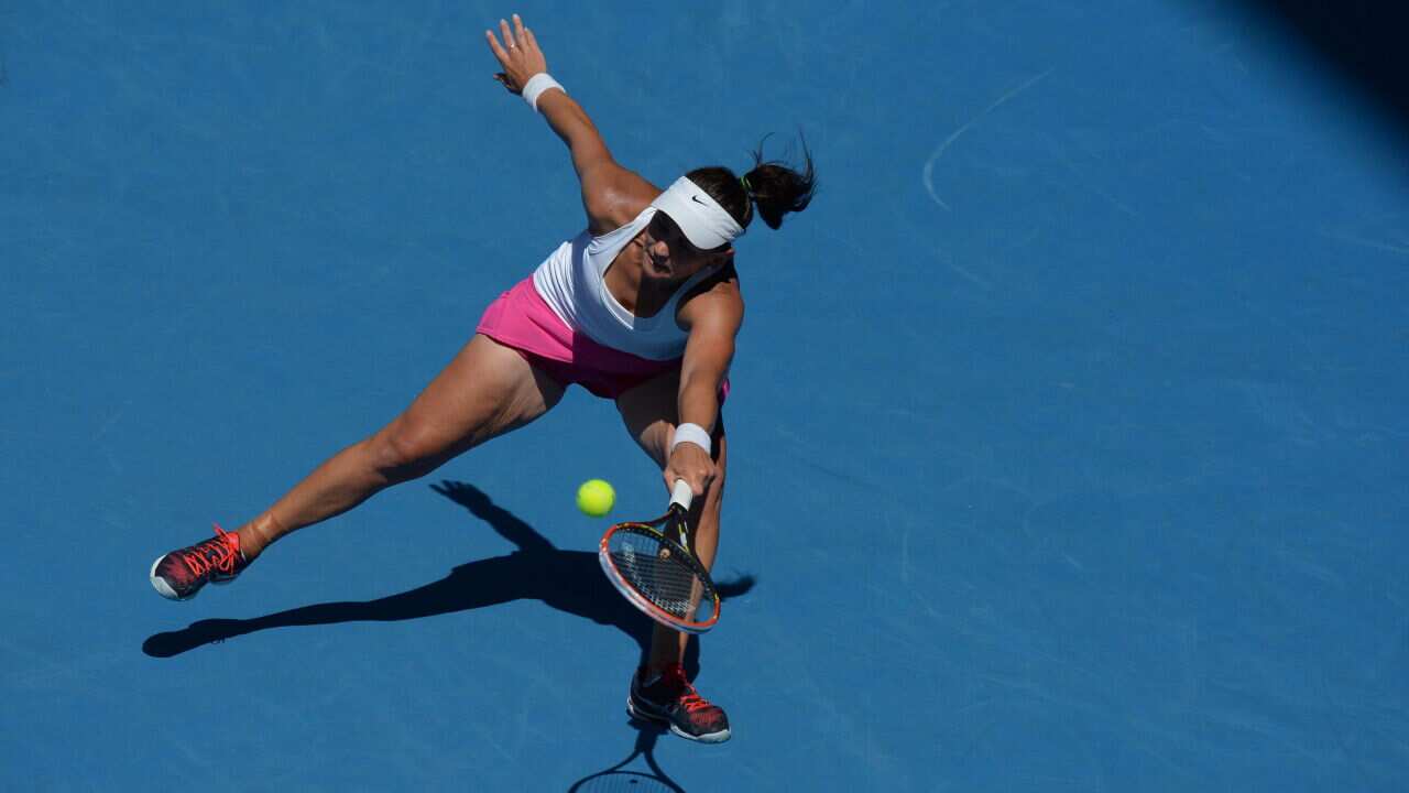 Australia's Casey Dellacqua plays a shot during her women's singles match against China's Zheng Jie - AAP-1.jpg