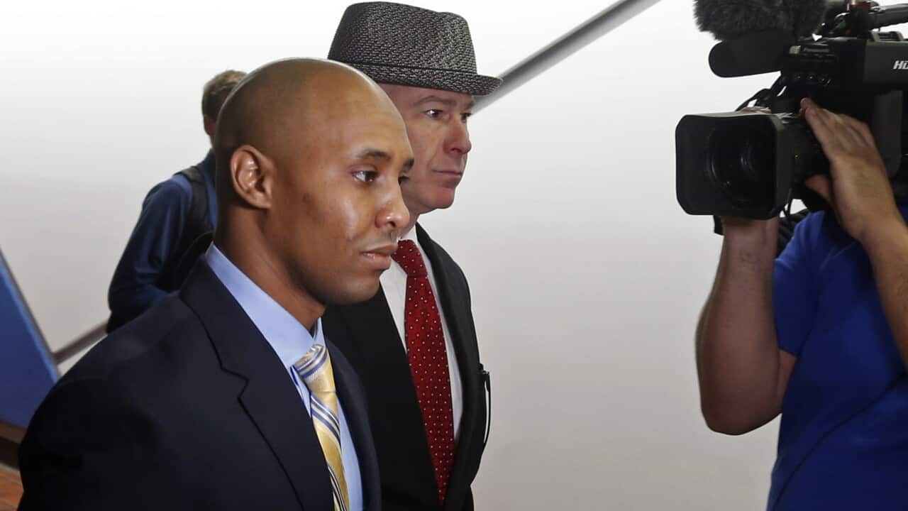 Mohamed Noor, left, waits with his attorney, Tom Plunkett, arrives at the Hennepin County Government Center for a hearing Tuesday, May 8