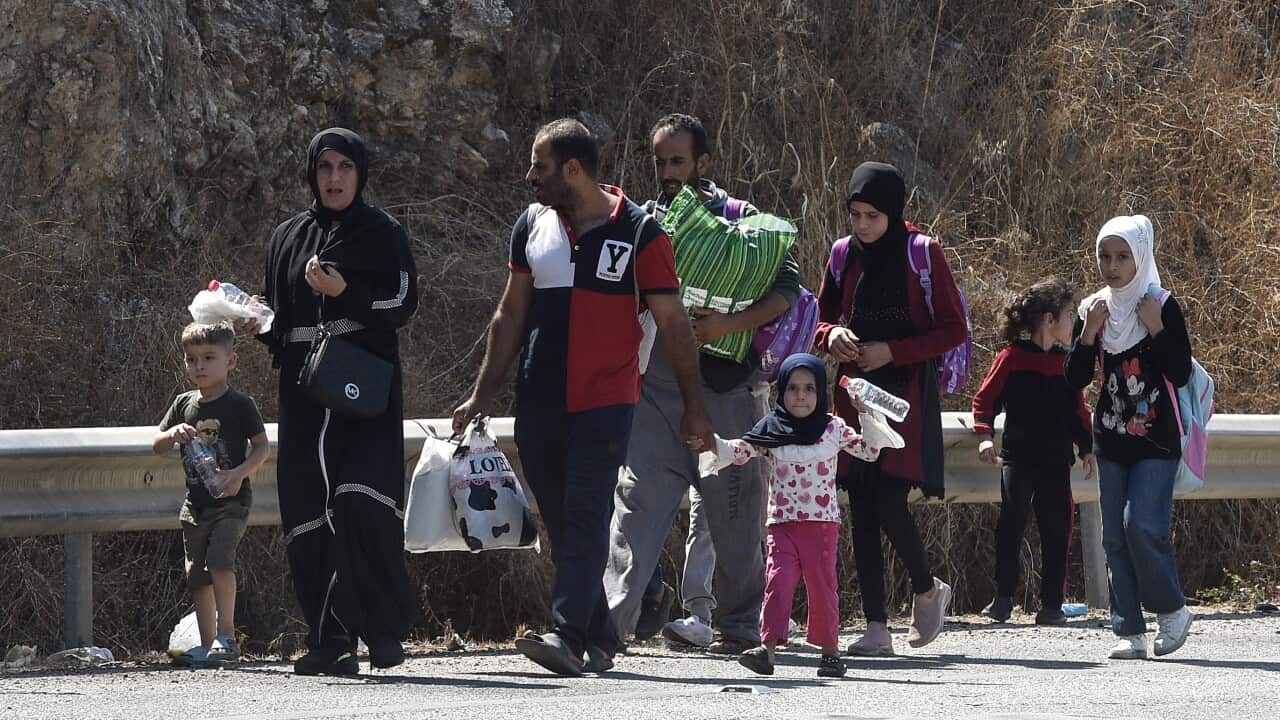 People walking along a hughway