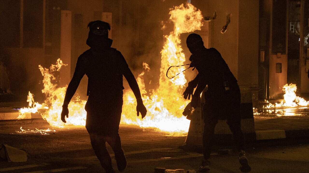 Protesters throw molotov cocktails.