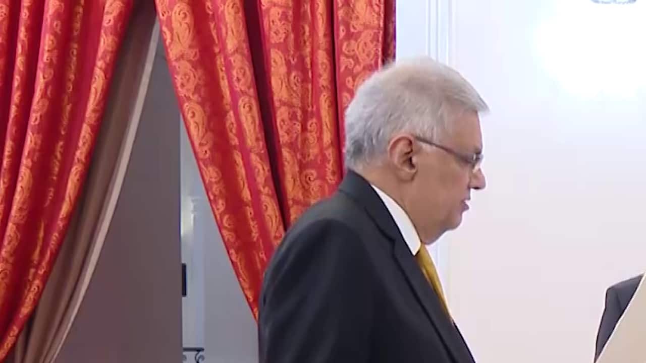 President Gotabaya Rajapaksa (right) greets Ranil Wickremesinghe during the latter's oath taking ceremony as the new prime minister, in Colombo.