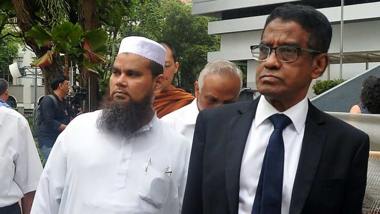 Islamic religious teacher Nalla Mohamed Abdul Jameel (L),