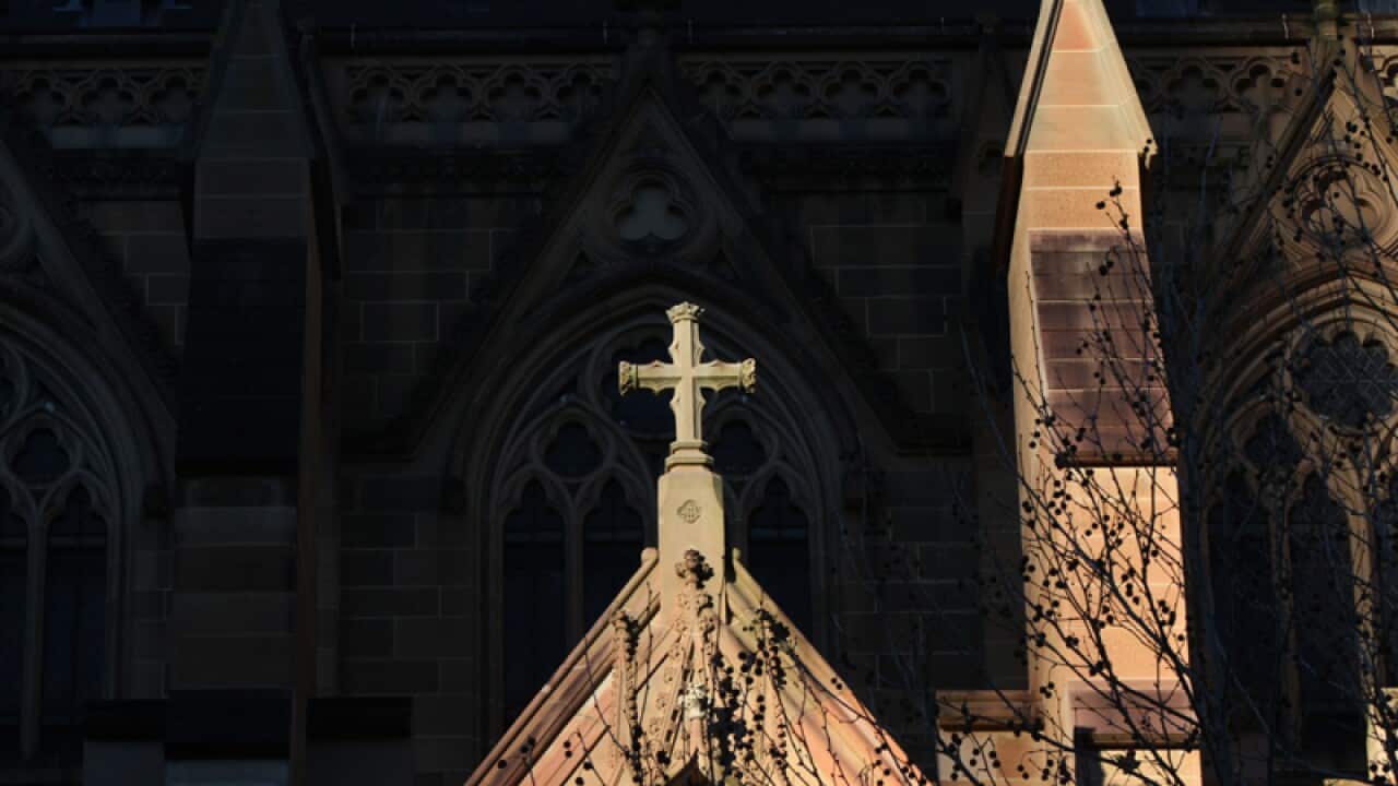 A cross on the exterior of St Mary's Cathedral