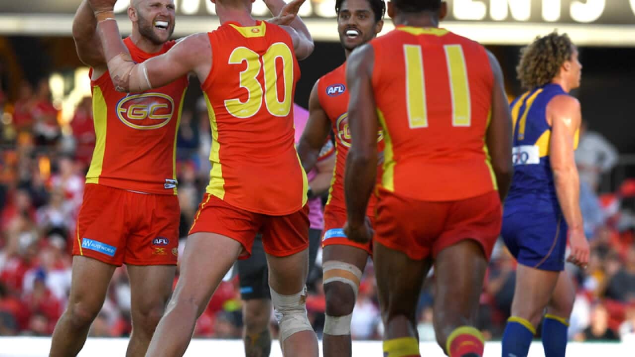 Gold Coast Suns players celebrating
