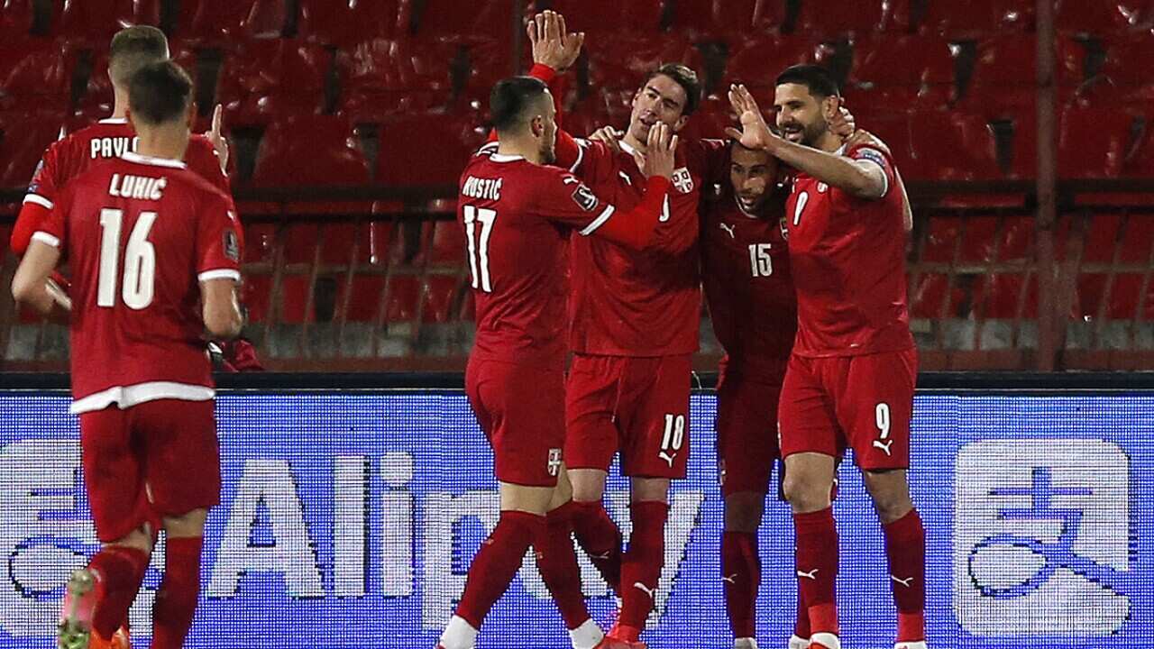 Aleksandar Mitrovic (right) celebrates with his teammates after scoring a goal against Ireland. 2022 World Cup qualifiers, Serbia, Belgrade, Rajko Mitic Stadium, 24th March 2021