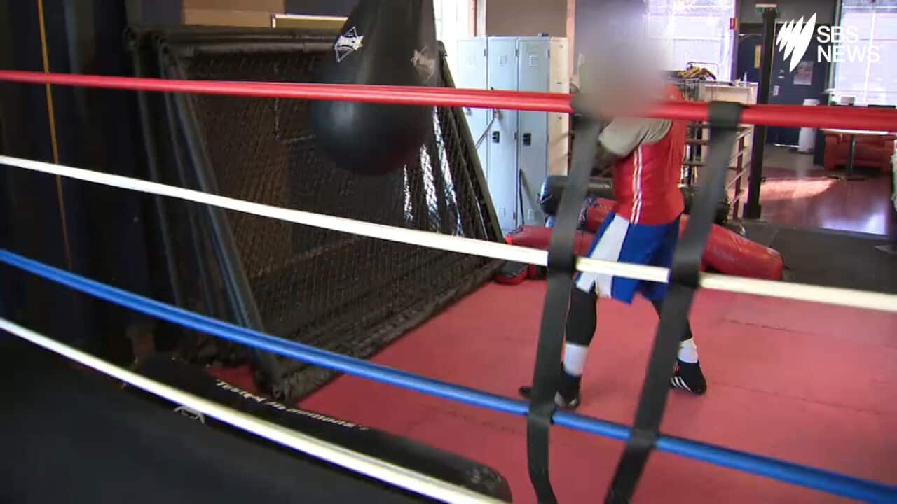 One of the athletes works out in the boxing ring