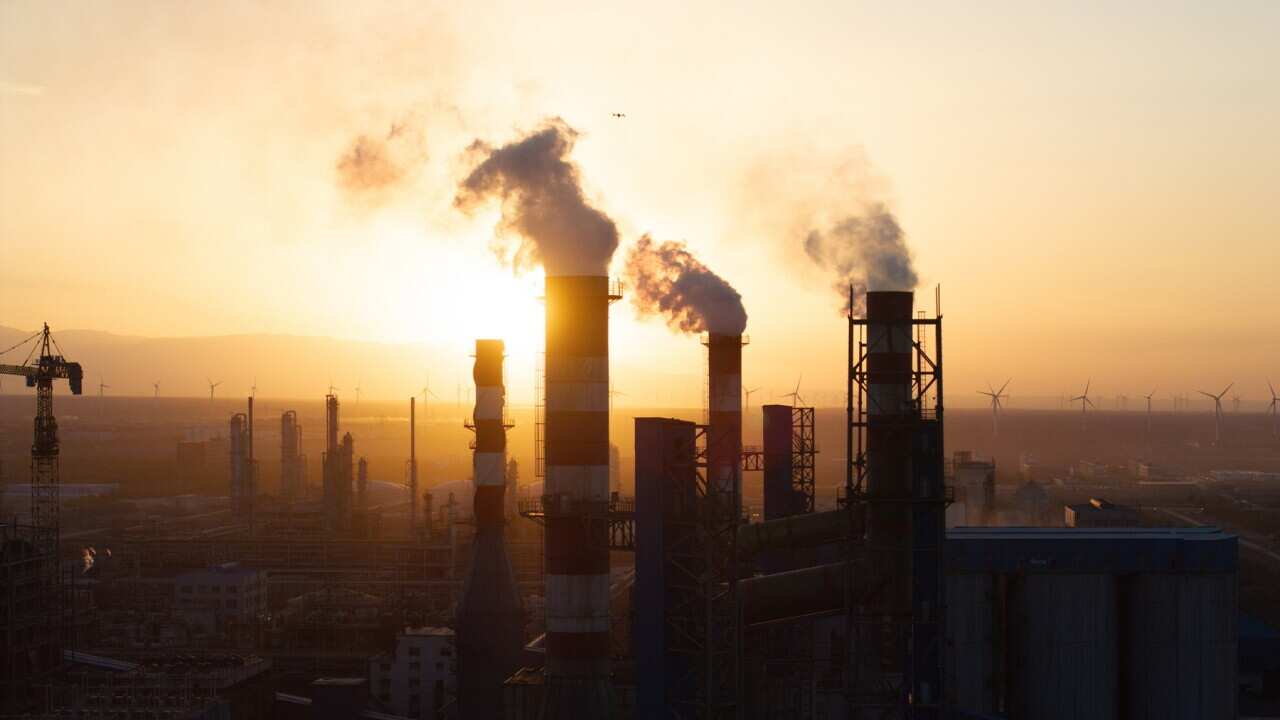 The chimney of the chemical plant is smoking