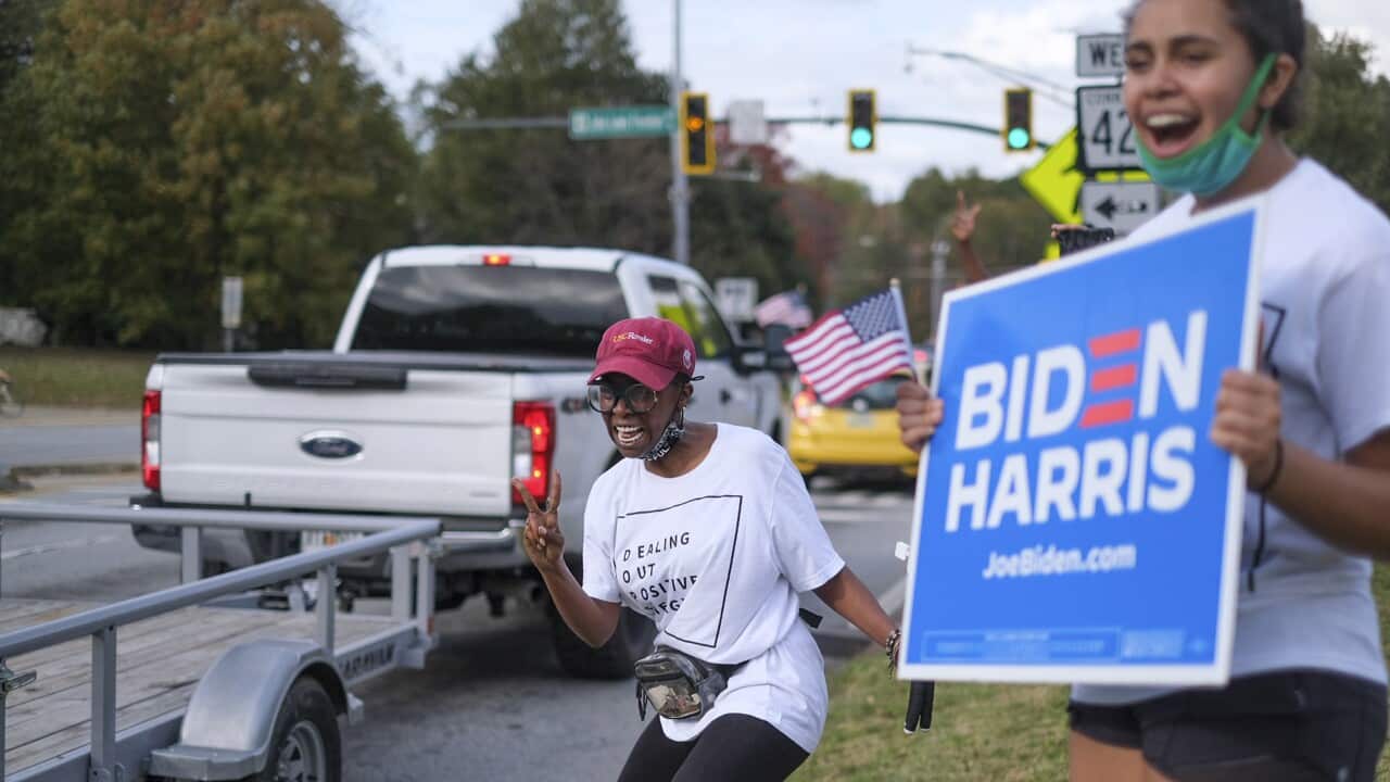 Voters celebrate in Atlanta as Democratic nominee Joe Biden is named President-elect on 7 November, 2020.
