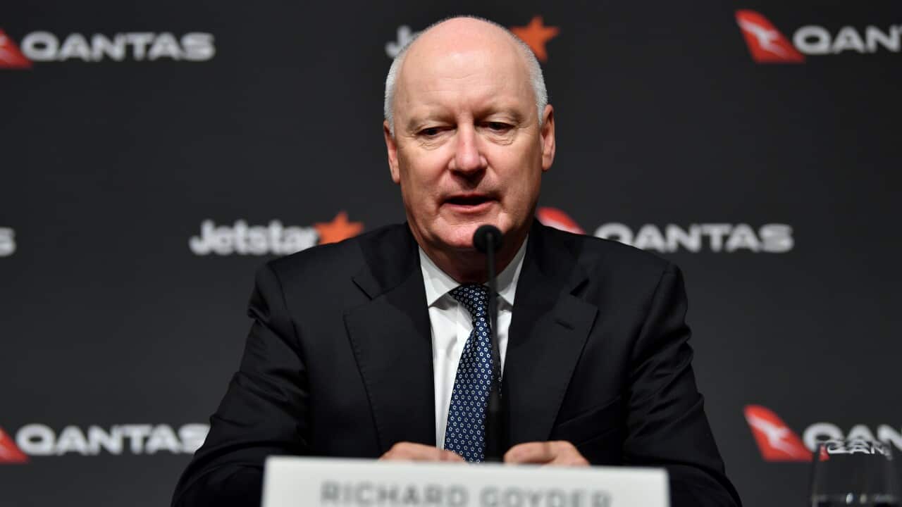 Chairperson of Qantas Airways Richard Goyder speaks to the media during a press conference