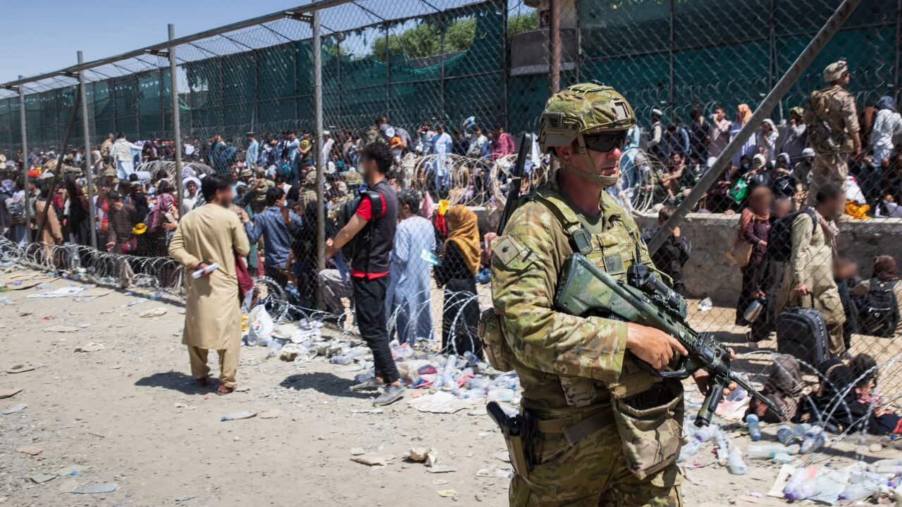 A supplied image shows Major Tim Glover, part of the 1st Battalion, Royal Australian Regiment ready combat team at Hamid Karzai International Airport in Kabul.