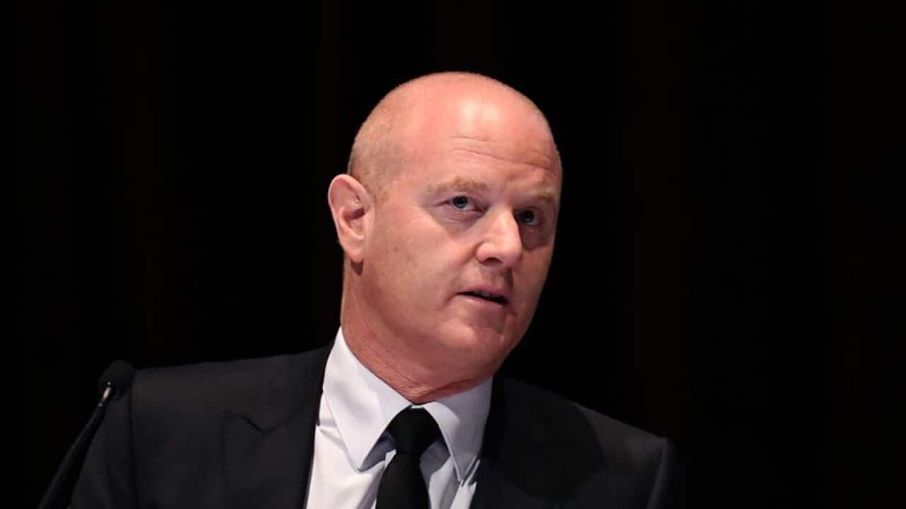Commonwealth Bank CEO Ian Narev sits after arriving to their (AGM).