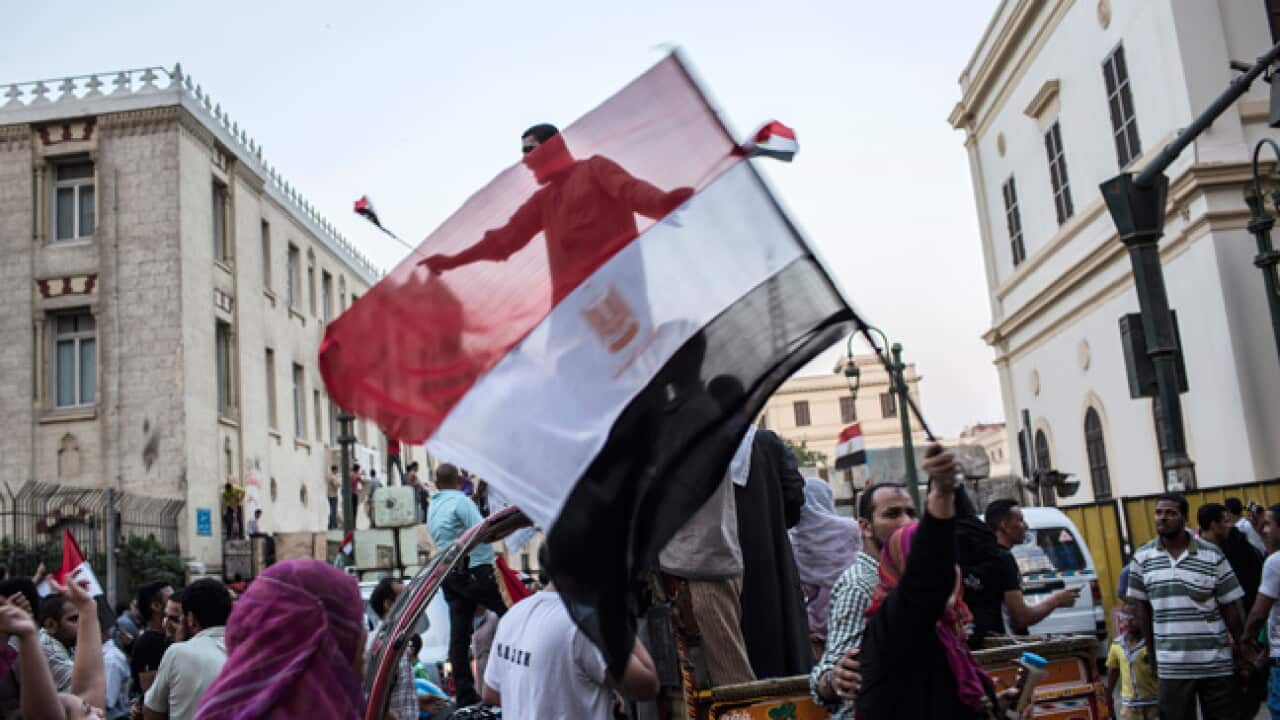 Egyptians celebrate the victory of the Muslim Brotherhood in Cairo. (Getty images)