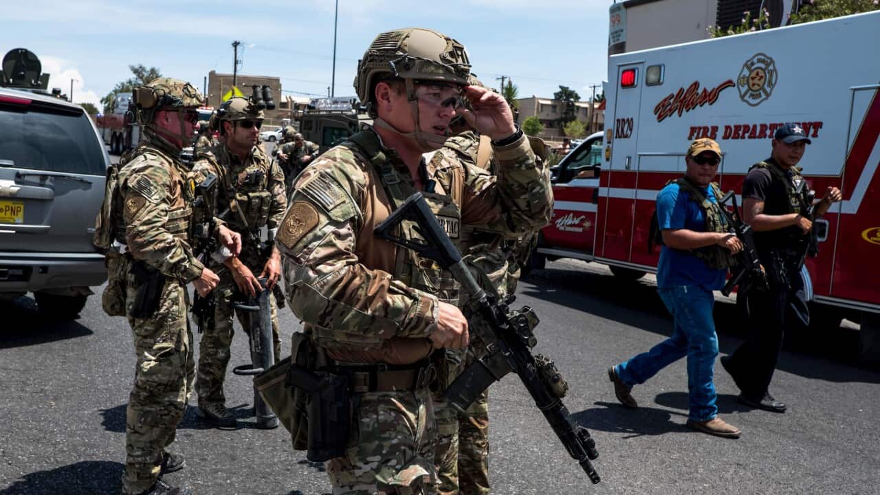 Police swarm the area around the Walmart near Cielo Vista Mall in El Paso, Texas, where the shooting occurred.