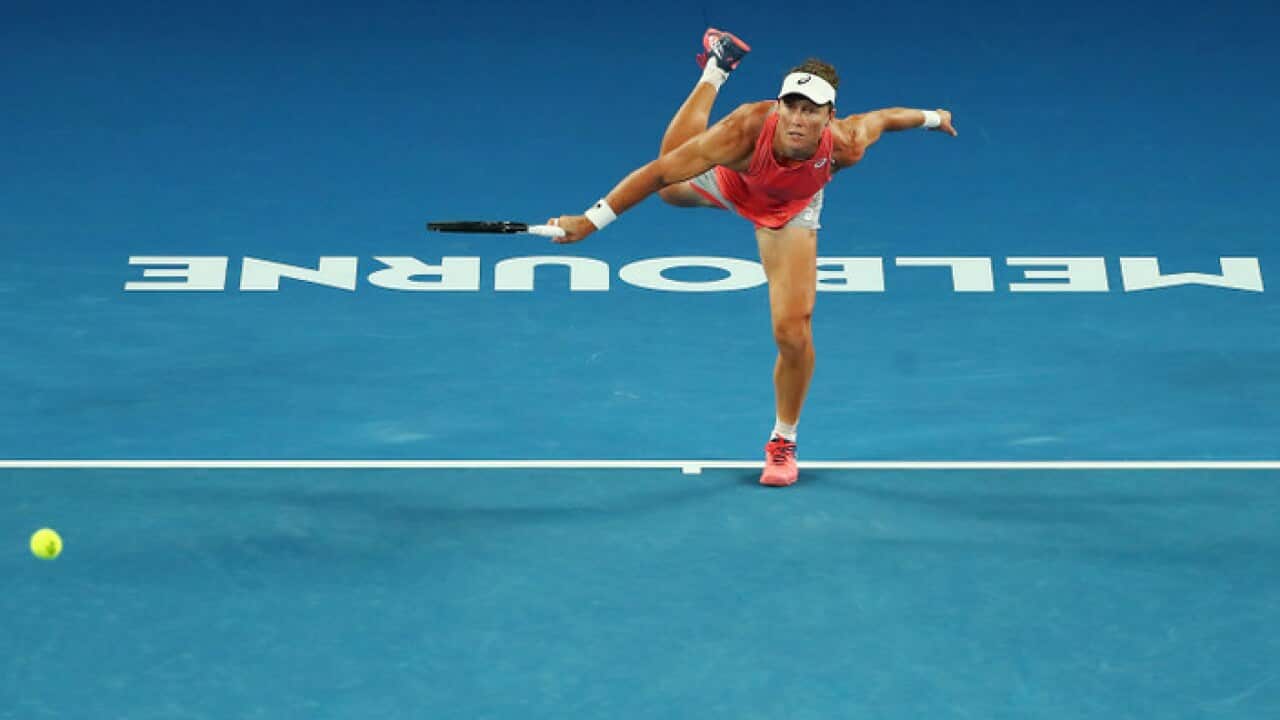 Samantha Stosur of Australia (with Shuai Zhan of China) in the women's semi final