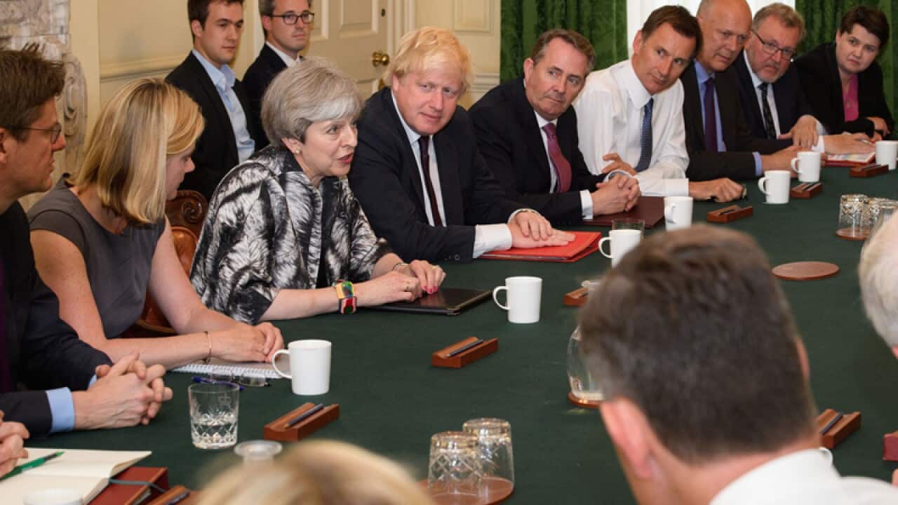 British Prime Minister Theresa May (C) during a Cabinet meeting