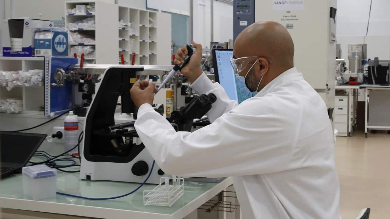 A researcher in a laboratory at the Sanofi Pasteur vaccine unit near Lyon, France