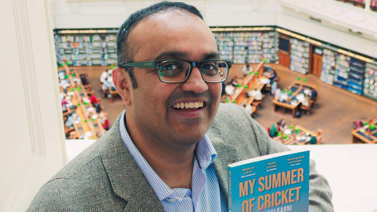Nikhil Kulkarni - author photo with book - 2.jpg