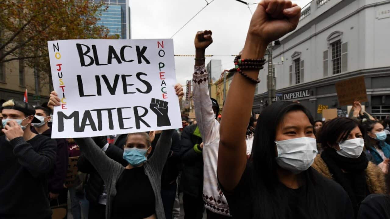 Protesters are seen during a Black Lives Matter rally in Melbourne, Saturday, June 6, 2020
