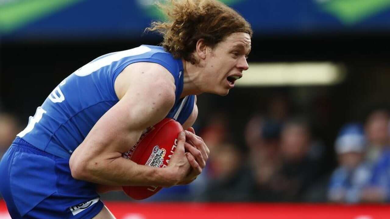 Ben Brown of the Kangaroos takes a mark