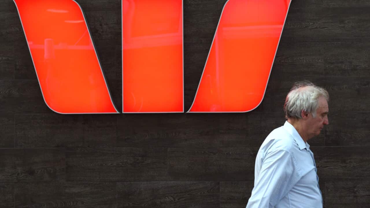 A pedestrian walks past a Westpac Bank in Sydney