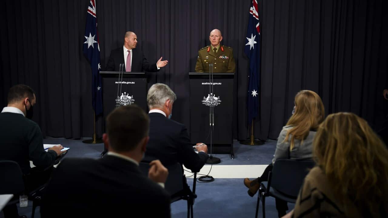 Australian Treasurer Josh Frydenberg (left) and COVID-19 Taskforce Commander, Lieutenant General John Frewen speak to the media during a press conference at Parliament House in Canberra, Wednesday, July 7, 2021. (AAP Image/Lukas Coch) NO ARCHIVING
