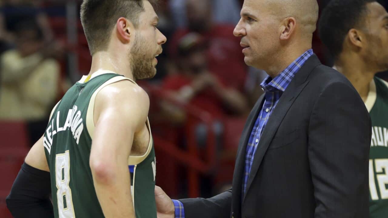 Milwaukee Bucks player Matthew Dellavedova (L)