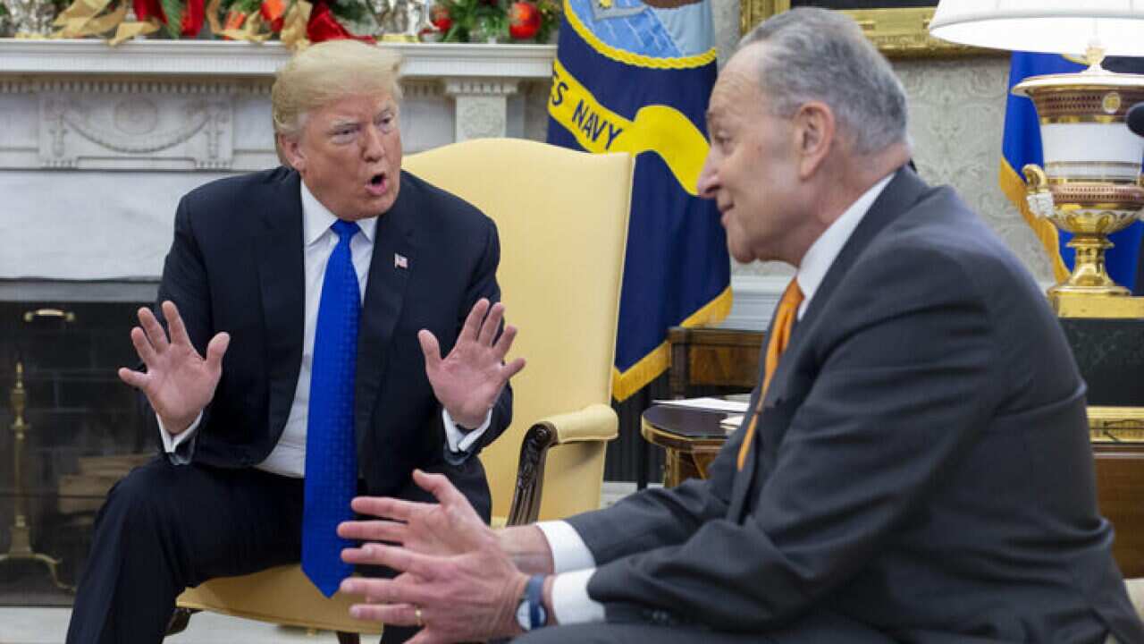 US President Donald Trump (L) clashes with Senate Minority Leader Chuck Schumer in the Oval Office of the White House