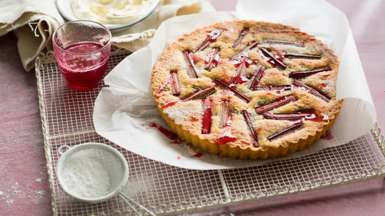 Rhubarb, pistachio and orange blossom frangipane tart with rhubarb syrup