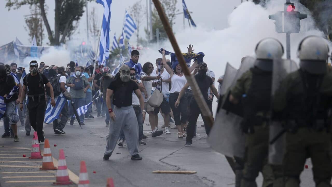 Protesters clash with riot police during a rally opposing Greece's name deal with neighbouring Macedonia.