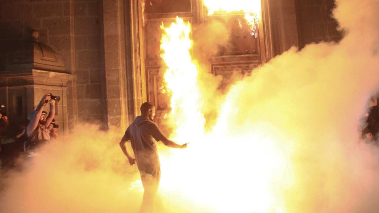 Students set fire to the National Palace in Mexico.