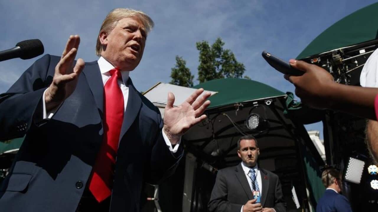 President Donald Trump speaks to reporters at the White House