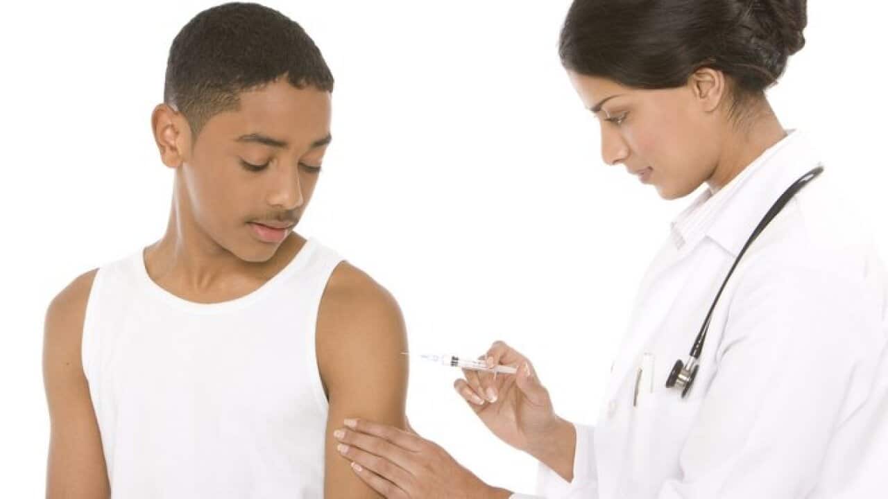 Teenage boy getting a vaccination