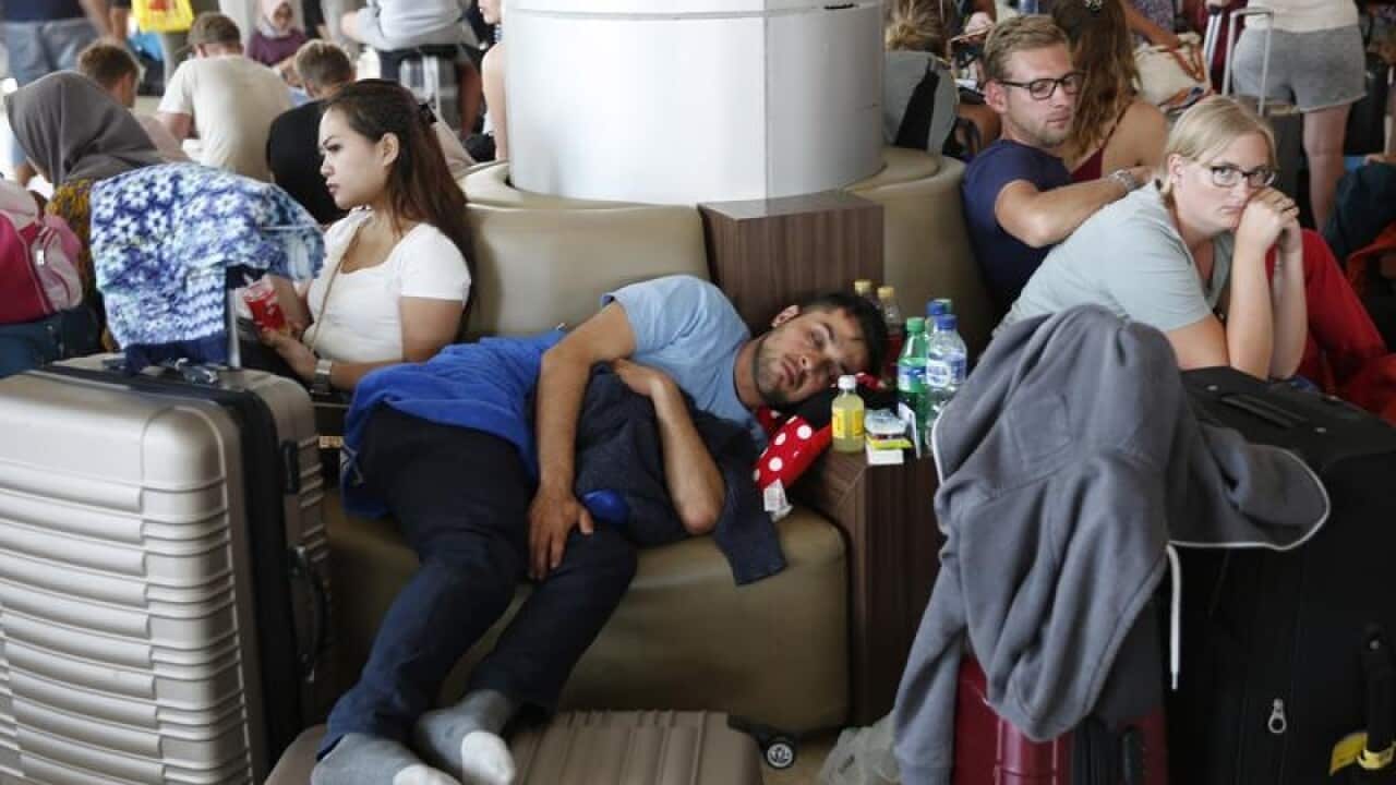 Foreign tourists are seen at the airport in Lombok.