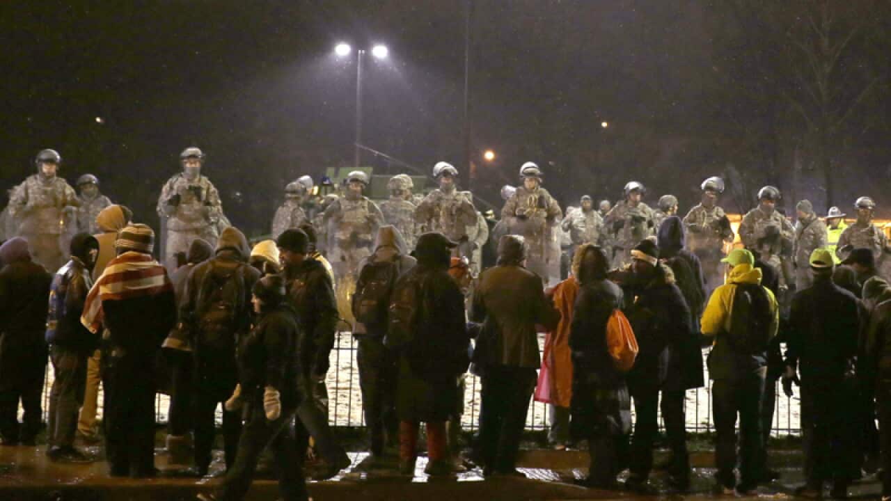 Protesters gather near the Ferguson Police Department