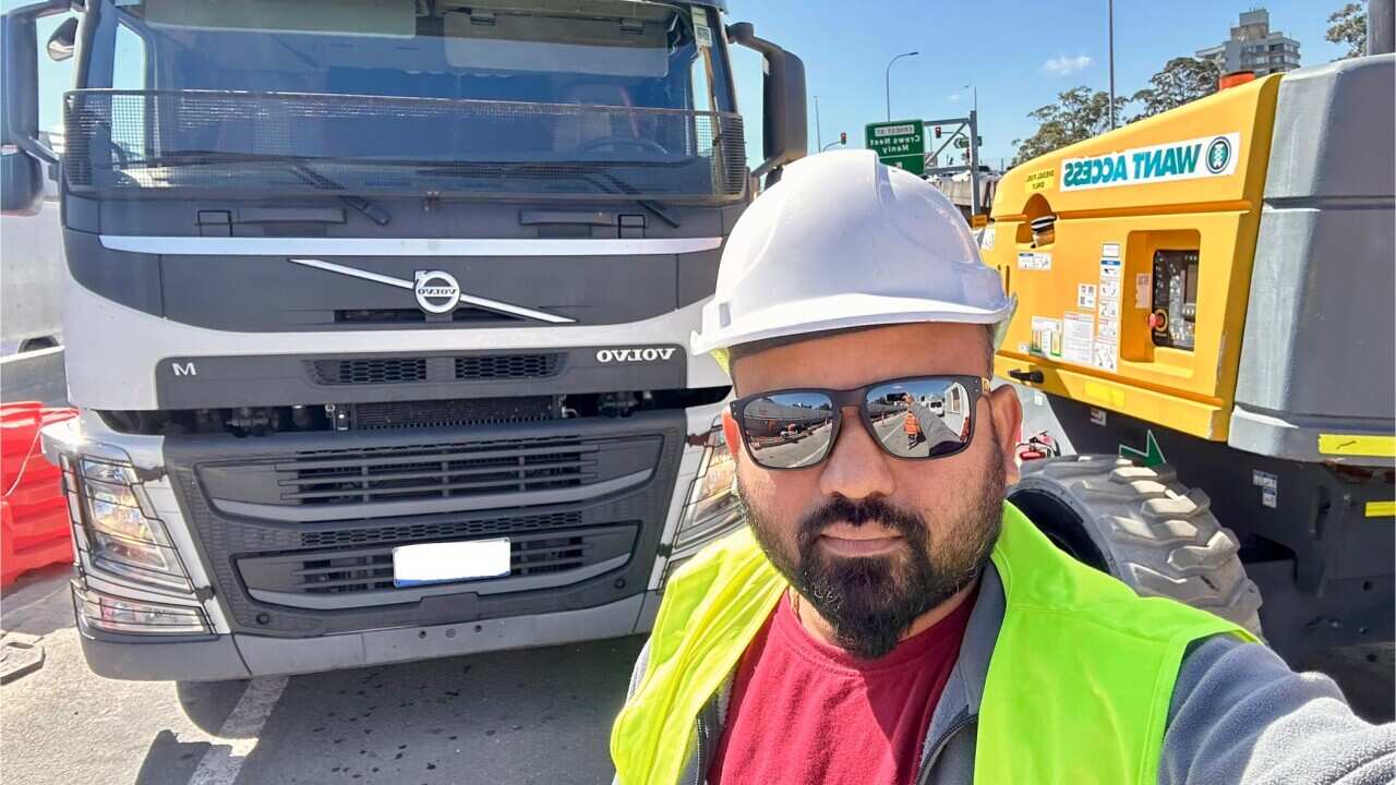 DHANUSHANTH INFRONT OF HIS TRUCK.jpg