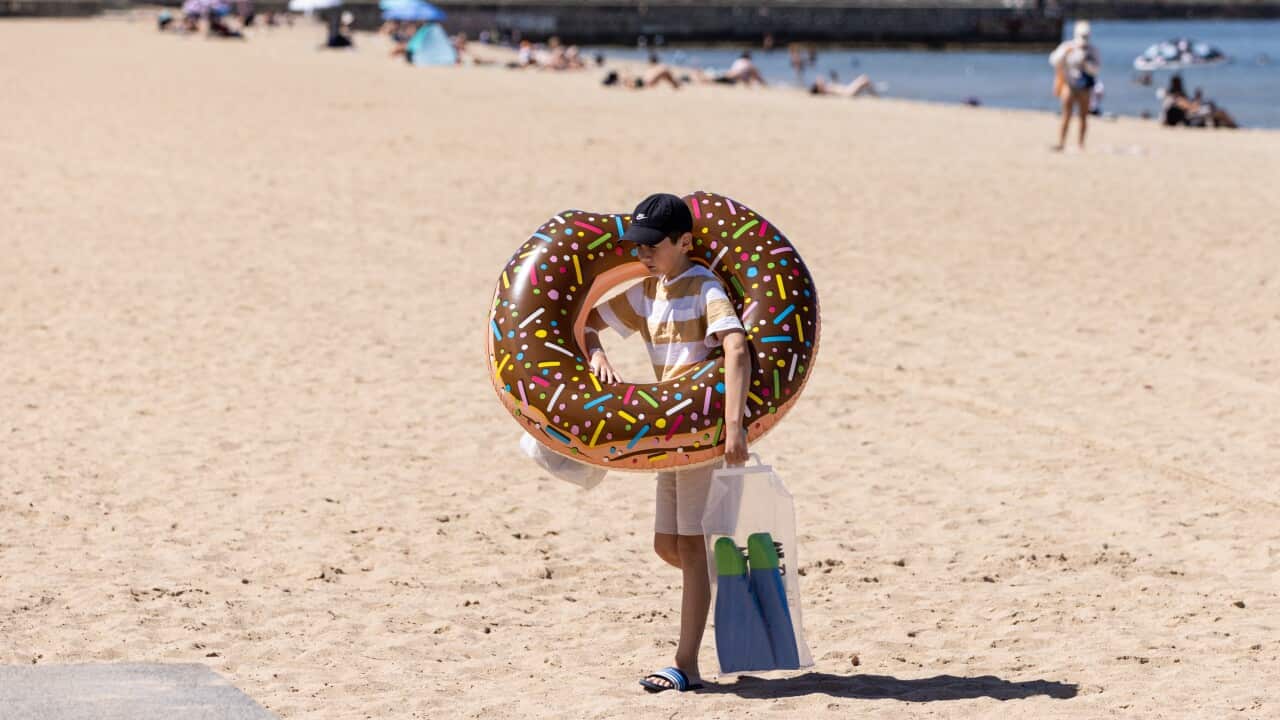 People are seen at Elwood Beach in Melbourne.