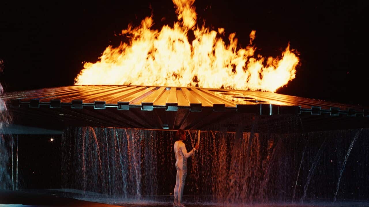 Cathy Freeman lighting the Olympic cauldron in 2000.