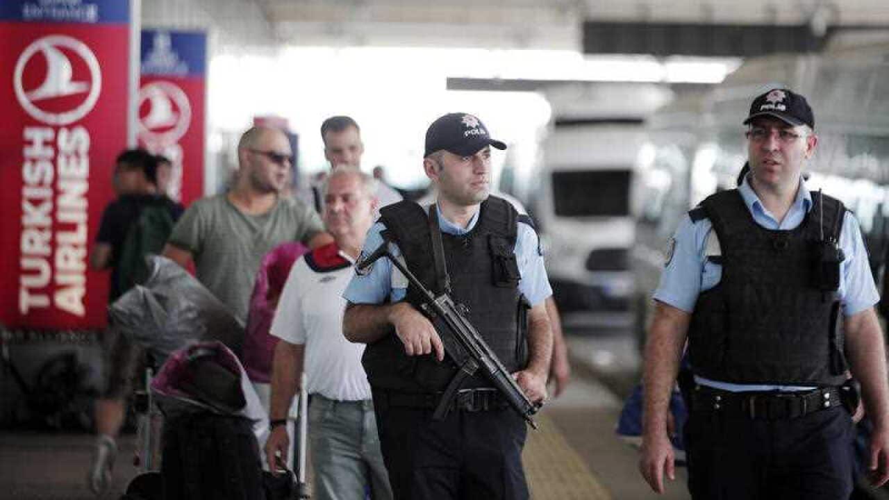 Turkish police officers patrol outside Istanbul's Ataturk airport