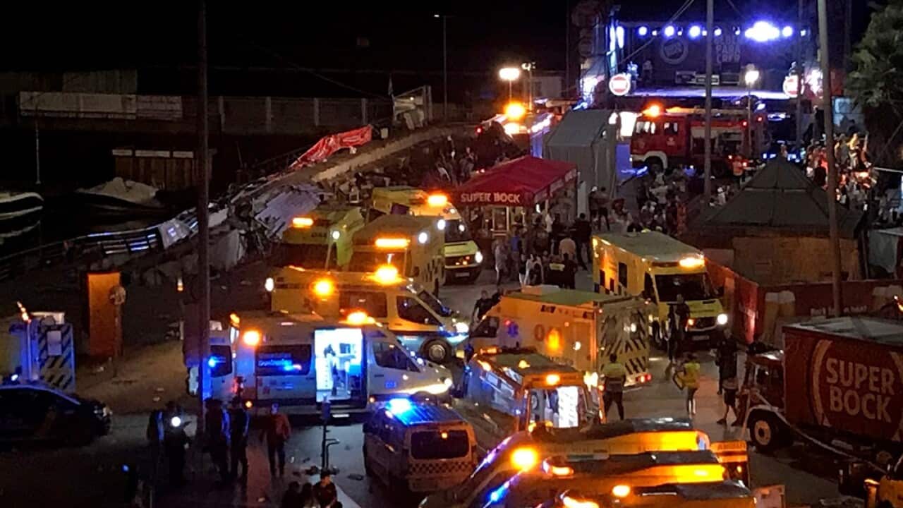 Several ambulances at the scene of where a walkway collapsed during a concert in Vigo, northwestern Spain.