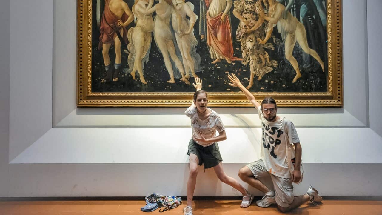 Protestors from the action group Ultima Generazione glue their hands to the glass covering Sandro Botticelli's La Primavera at Uffizi on July 22, 2022 in Florence, Italy.
