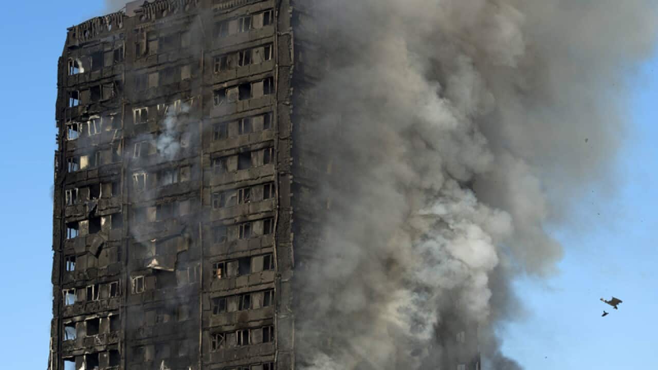 Smoke rises from the fire at the Grenfell Tower