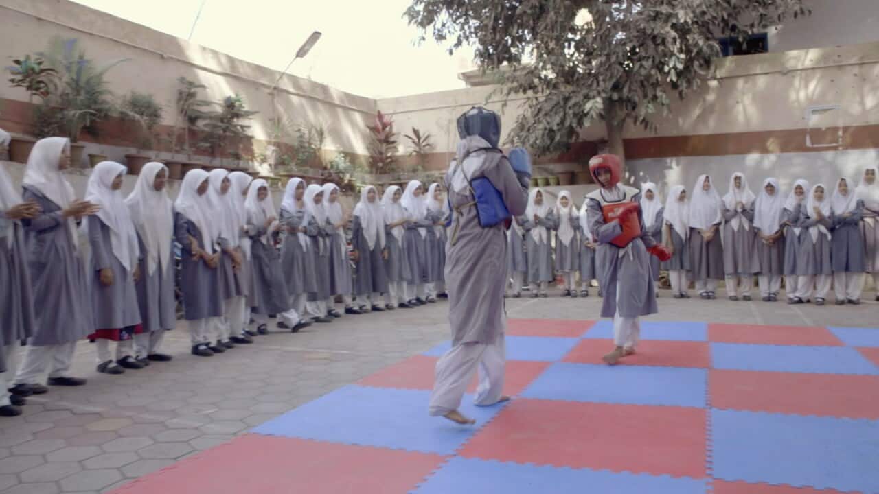 Student in a school in Hyderabad, India, fight each other in the martial art of Wushu.