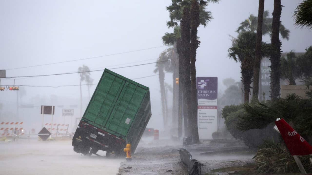 A power generator tips in front of the Christus Spohn Hospital in Corpus Christi, Texas, as Hurricane Harvey hits.